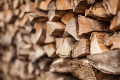 background of Heap firewood stack, natural wood